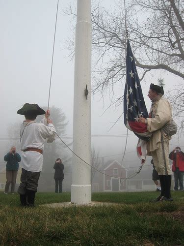 Colonial Militia Rasing Flag Brian Courtney Flickr