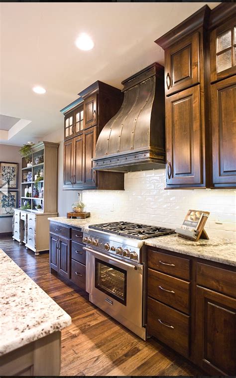 The backsplash is really easy to clean up since it is wipeable which is must when it comes to all backsplashes. Pin by Roslyn Meadows on Kitchens | Dark wood kitchens ...