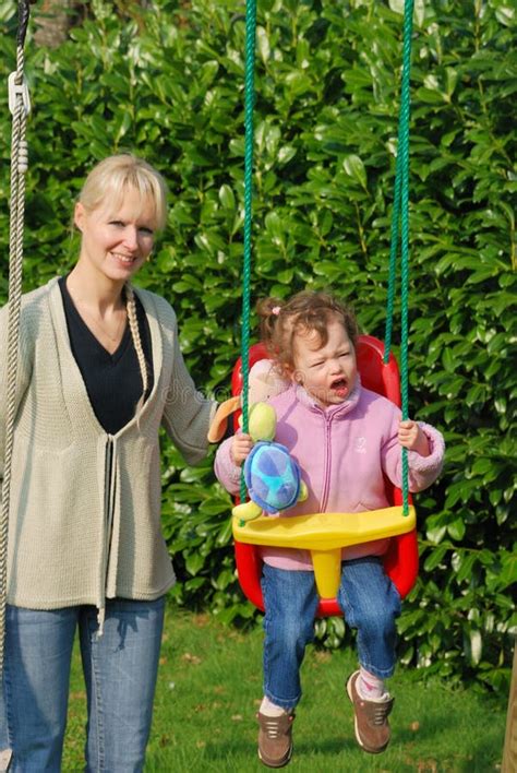 Mother Playing With Her Baby In A Swing Stock Image Image Of Juvenile