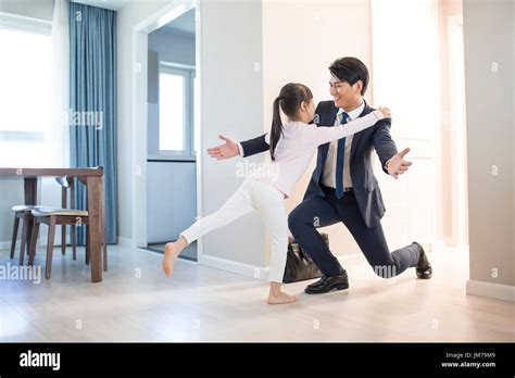 Young Chinese Father Come Back Home From Work Stock Photo Alamy