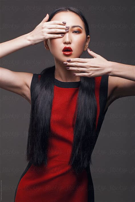 Portrait Of Asian Girl Long Hair Red Lips By Stocksy Contributor