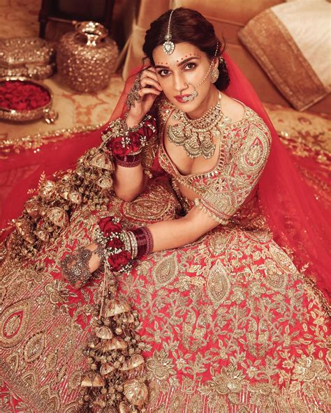 Kriti Sanon In A Gorgeous Red Bridal Lehenga In Manish Malhotra Outfit