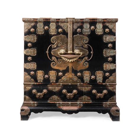 A Korean Brass Mounted Ebonised Temple Cabinet On Stand