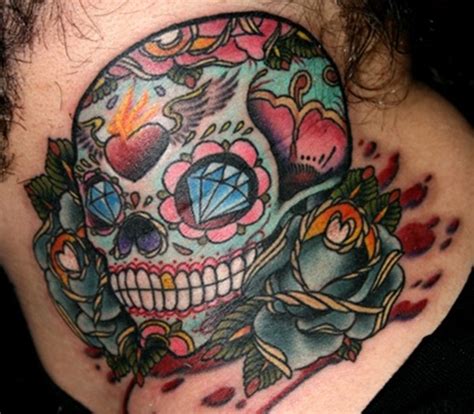 Traditionally, sugar skulls represent a departed soul and are placed at a grave or shrine on the day of the dead in mexico. sugar-skull-tattoo-meaning-25 - TatuaggiStyle.it