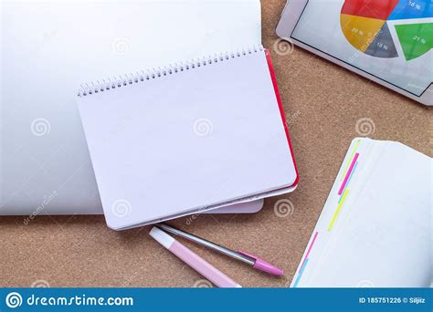 Notebook White Paper With Copy Space On A Desk Tablet With Diagram