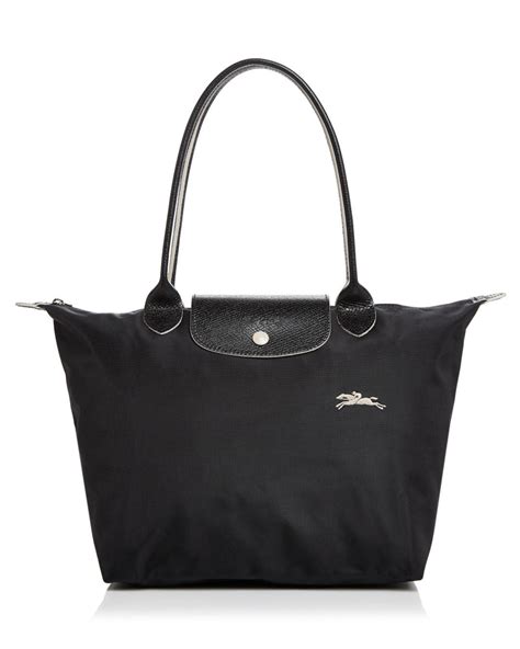 Soft and lightweight, this small handbag is ideal for carrying all of your essentials. Longchamp Fur Le Pliage Club Small Shoulder Tote - Lyst