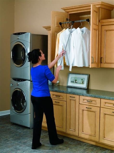 Custom closet design isn't as easy as it looks. retractable drop down hanging rack...just push up and ...