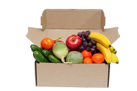 Premium Photo Fresh Vegetables And Fruits In A Cardboard Box On A