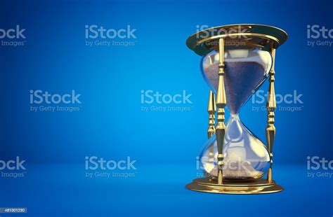 Golden Hourglass On Blue Background With A Copyspace Stock Photo