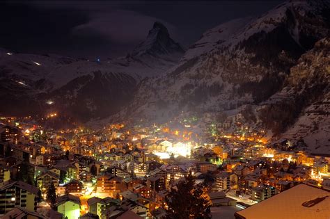 Winter Night at Winter Village in the Swiss Alps by Unsplash