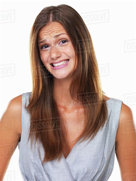 Studio Portrait Of Woman With Fake Smile Stock Photo Dissolve