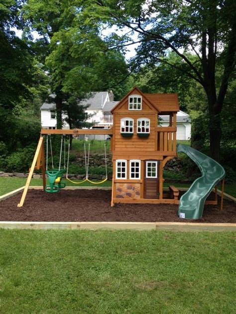 Swing sets and playsets for kids. Mulch wood, wooden playset, swings, plastic slide and ...