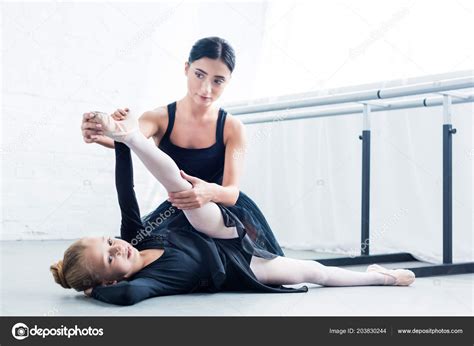 Young Ballet Teacher Helping Child Stretching Training Ballet School