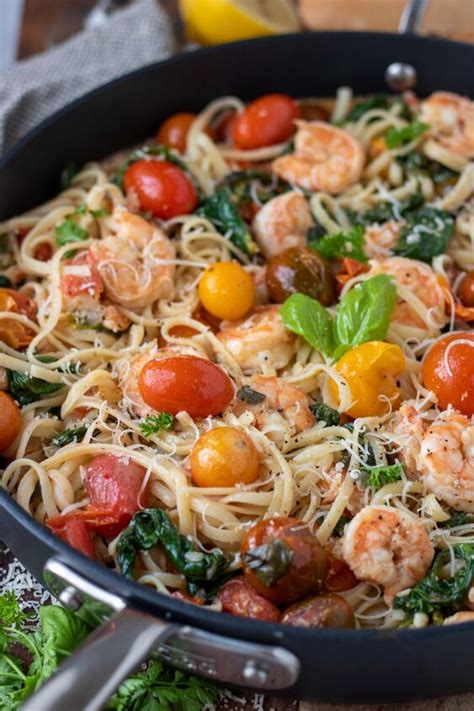 shrimp pasta with cherry tomatoes rosé and spinach foodtalk