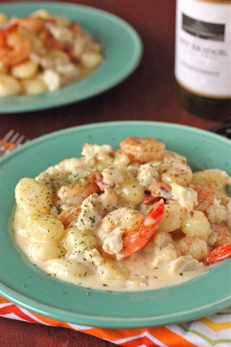 On sheet of wax paper or a paper plate combine flour, parmesan cheese, and 1/4 tsp each salt and pepper. Seafood Gnocchi with White Wine Parmesan Sauce | Recipe ...