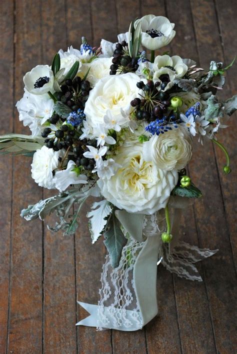 Maybe you would like to learn more about one of these? Black & white bridal bouquet, garden rose, anemones ...