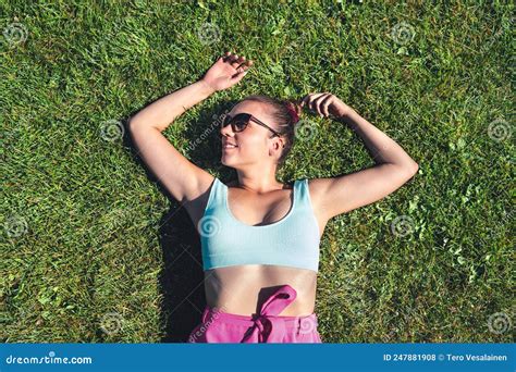 Resting In Grass In Green Garden Above Top View Woman Lying Down Relaxing In The Nature Lazy