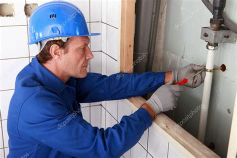 #contractor #plumber #draincleaner #drain #tradesman. Plumber working on water pipes — Stock Photo ...