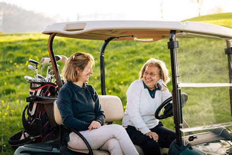 Women Laughing At Golf Carts By Stocksy Contributor Sergio Marcos
