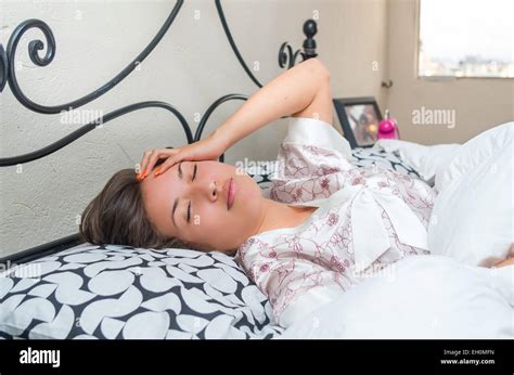 Cute Young Girl Waking Up In Bed Stock Photo Alamy