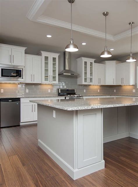 Stock kitchen cabinets come in standard sizes and dimensions that are important to know when planning your kitchen remodel. Plenty for the eye to see in this stunning kitchen - two ...