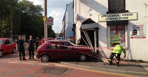 Crash Leaves Car Embedded In Oldham Corner Shop Wall Manchester