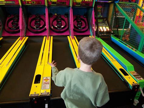 Ben Playing Skee Ball L Chuck E Cheese Flickr Photo Sharing