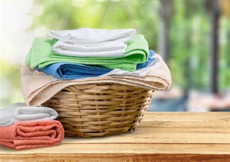 Folded Clothes In Laundry Basket Recharge Towels Laundry Hacks