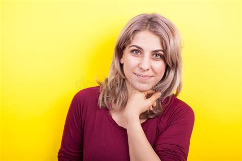 Portrait Of Beautiful Young Woman Over Yellow Background Stock Photo
