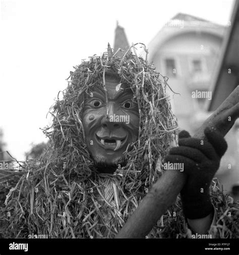 masked man with pointed teeth and a suit made of straw carnival around 1950 freiburg germany