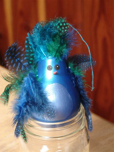 In recent years, hardware stores like home depot and lowes have offered christmas light recycling for their customers. recycled light bulb peacock craft | Light bulb ornaments ...