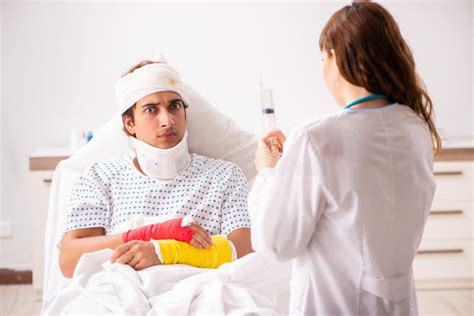 The Young Doctor Examining Injured Patient Stock Photo Image Of Brace