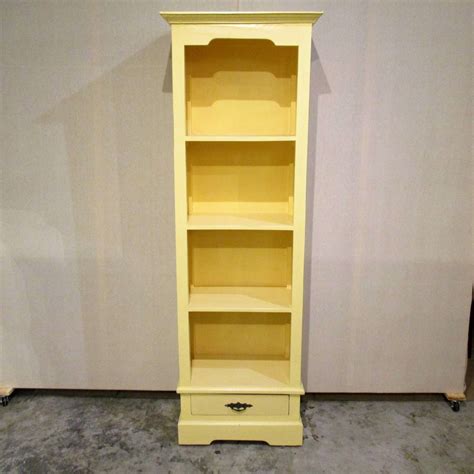 A little extra storage never hurts. Narrow Bookcase with Single Drawer - Nadeau Charleston