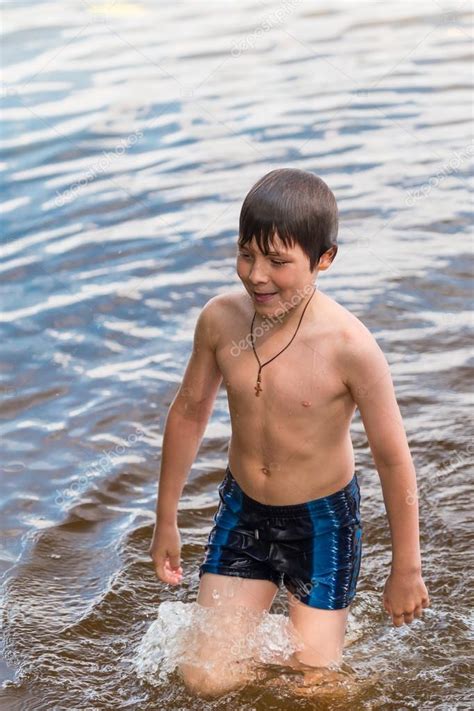 Little Boy Swimming In A Lake Stock Photo By ©annamoskvina 44082597