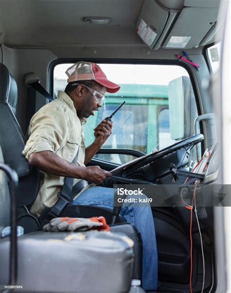 Africanamerican Truck Driver On Walkietalkie Stock Photo Download