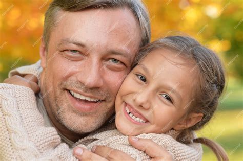 Premium Photo Happy Father And Daughter Posing Outdoor In Autumn