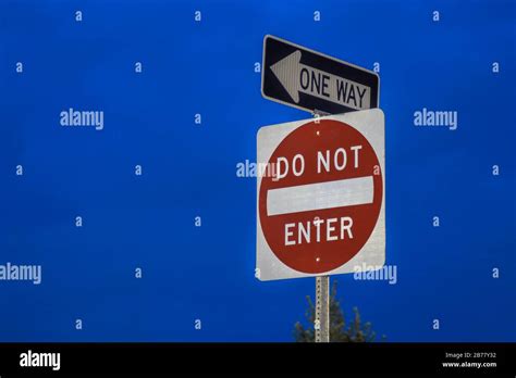 Night View Of A Do Not Enter Sign And One Way Sign Stock Photo Alamy