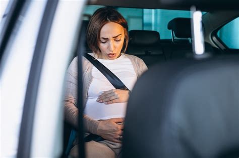 Free Photo Young Pregnant Woman Driving In Car To Hospital