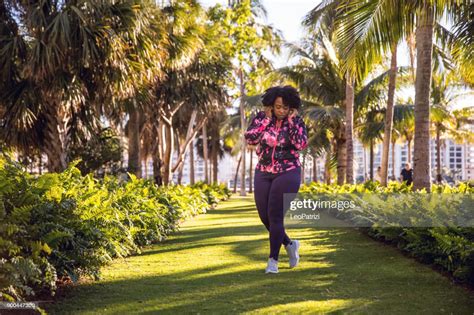 Curvy Young Black Woman Walking Jogging And Running In Miami Beach