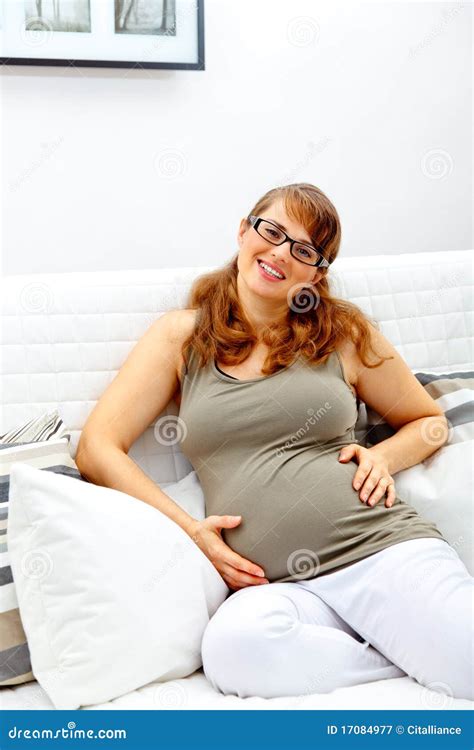Smiling Pregnant Woman Sitting On Couch Stock Image Image Of Femininity Holding 17084977