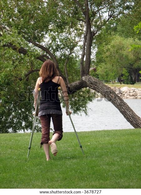 Girl On Crutches Stock Photo Edit Now 3678727