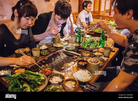 Friends Eating Korean Barbeque In Myeongdong Restaurant Myeongdong 8