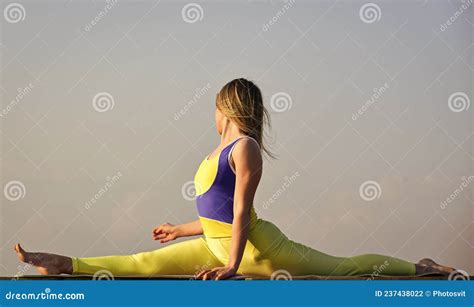 healthier and happier stretching muscles woman practicing split flexible girl outdoor stock