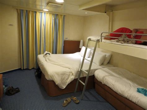 The breeze looks very tropical, with the cabins done in bright blue, yellow, and gold, with light walls. Carnival Breeze Deck Plans - Cabin Diagrams - Pictures