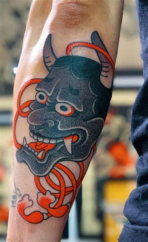 A Person With A Tattoo On Their Arm