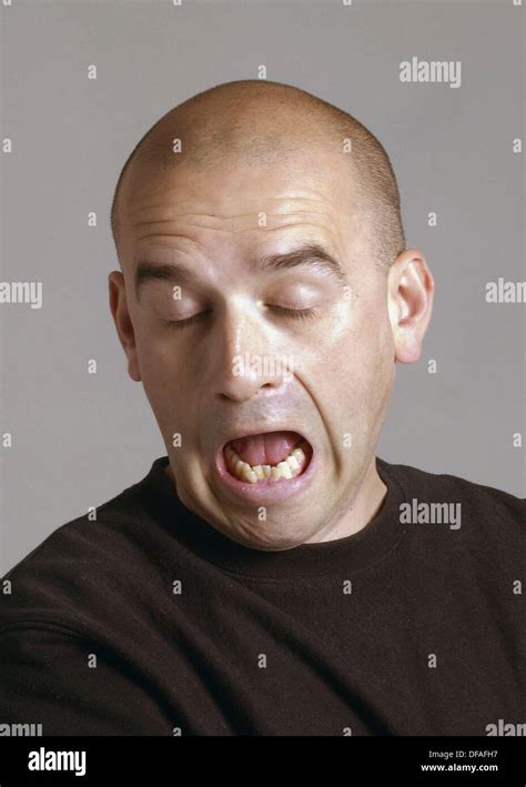 Bald 38 Year Old Man Showing A Boredom Expression Stock Photo Alamy