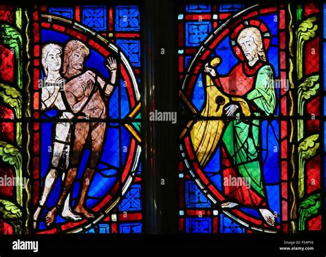 Stained Glass Window Depicting Adam And Eve In The Cathedral Of Tours