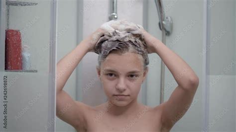 Smiling Young Girl Bathing Under A Shower At Home Beautiful Teen Girl Taking Shower And Washing