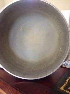 The first step of solving the problem is by cleaning the surface of the aluminum part by rinsing it in hot water for some minutes. Need help cleaning/polishing aluminum cookware