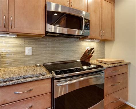 If you go with the darker countertops, you can go with a lighter backsplash but make sure it includes at least a hint of the countertops main. Great Kitchen Tile Backsplash to go with Maple Toffee ...
